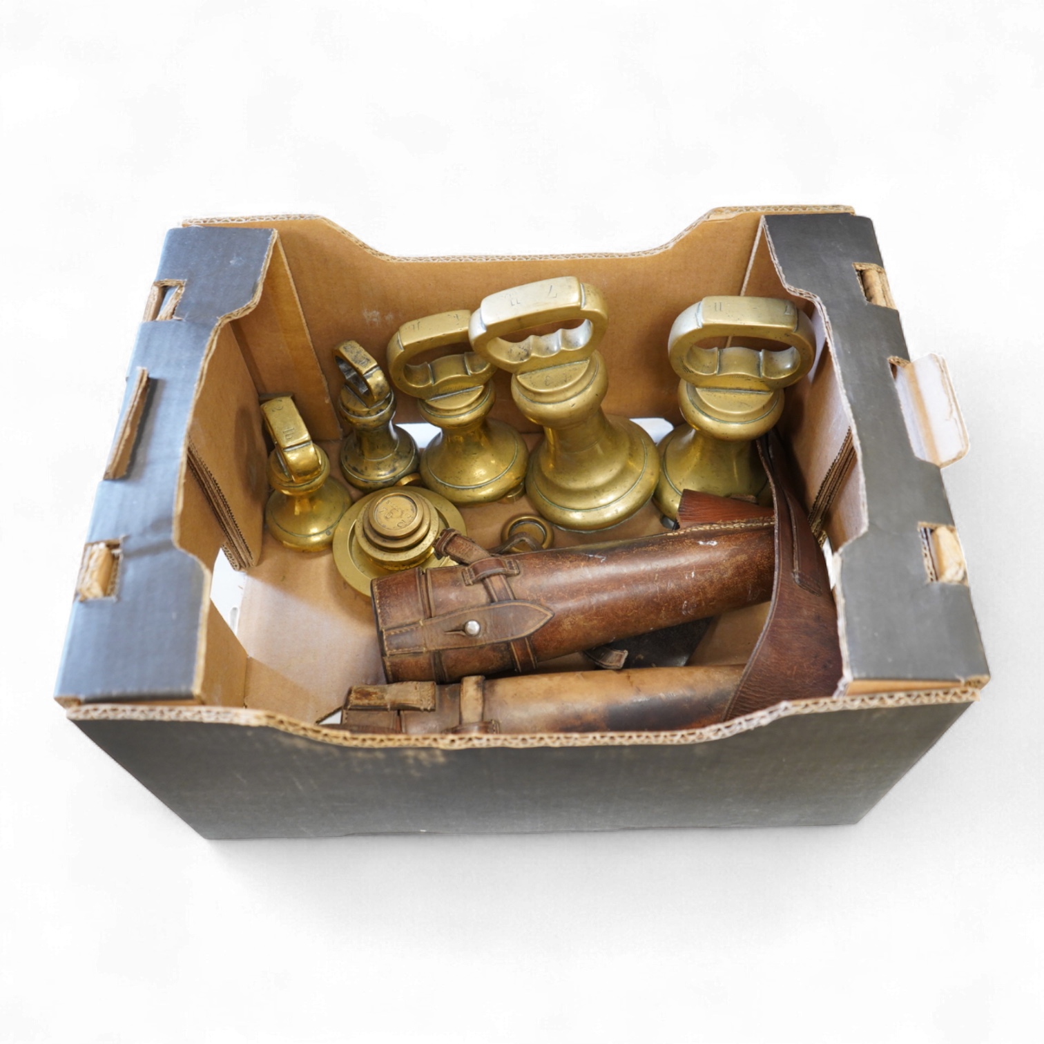 Two leather-cased spirit flasks and graduated set of brass weights